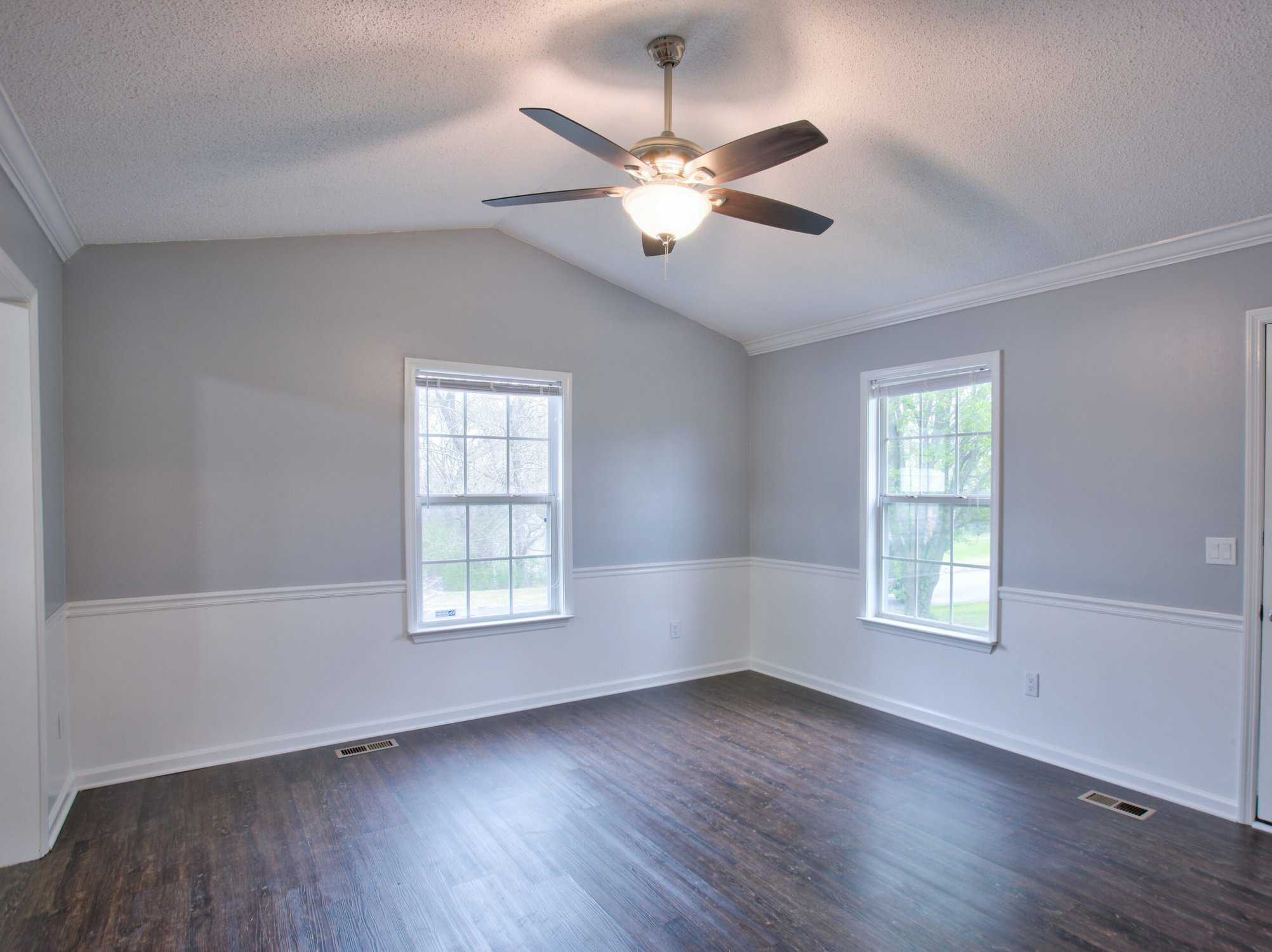 Gray living room interior with vaulted ceilings- interior house painters in Erie, CO