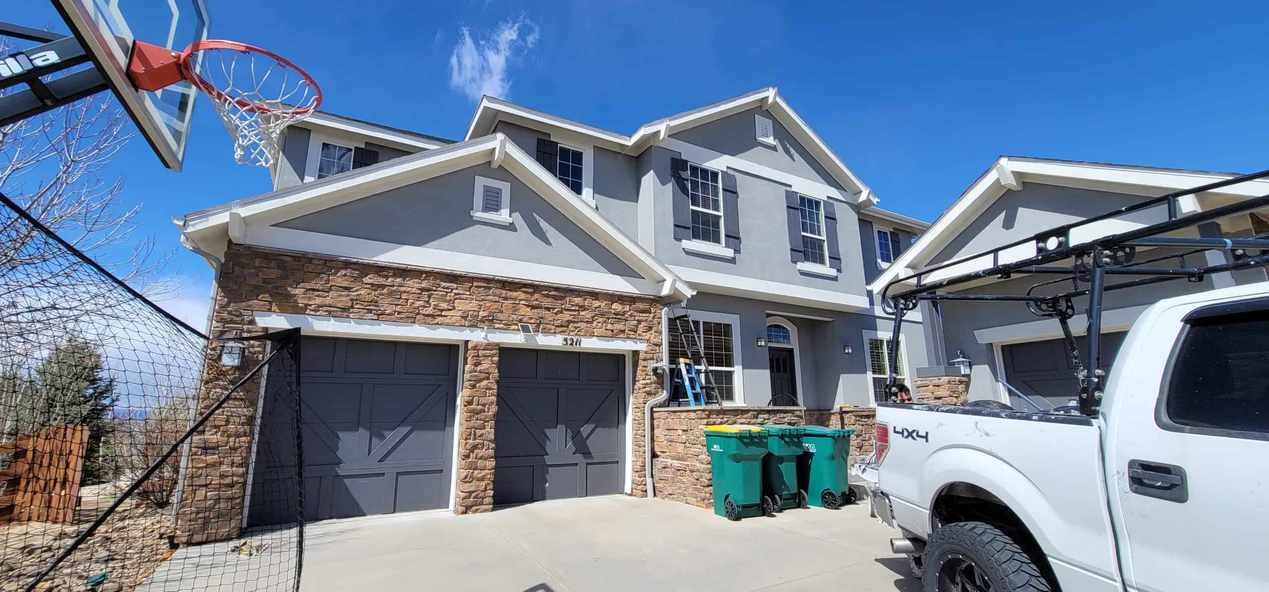 Newly Painted House Exterior with Garage and Driveway- painting services in Erie, CO