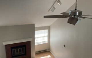 Interior House Painting Services Top view of empty area with fireplace- Interior House Painting Services in Erie, CO